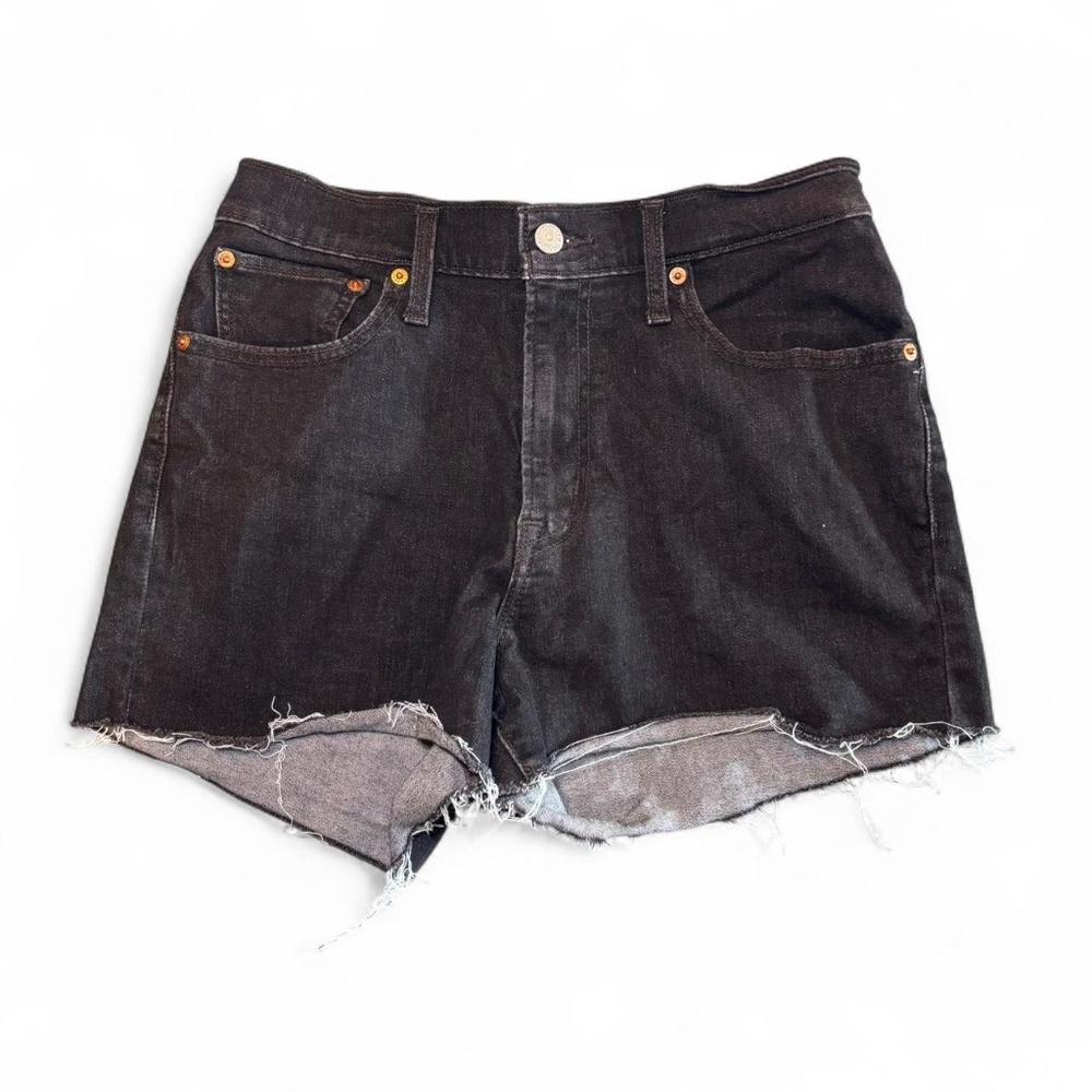 Levi black denim shorts with a unique distressed look. High rise size 30